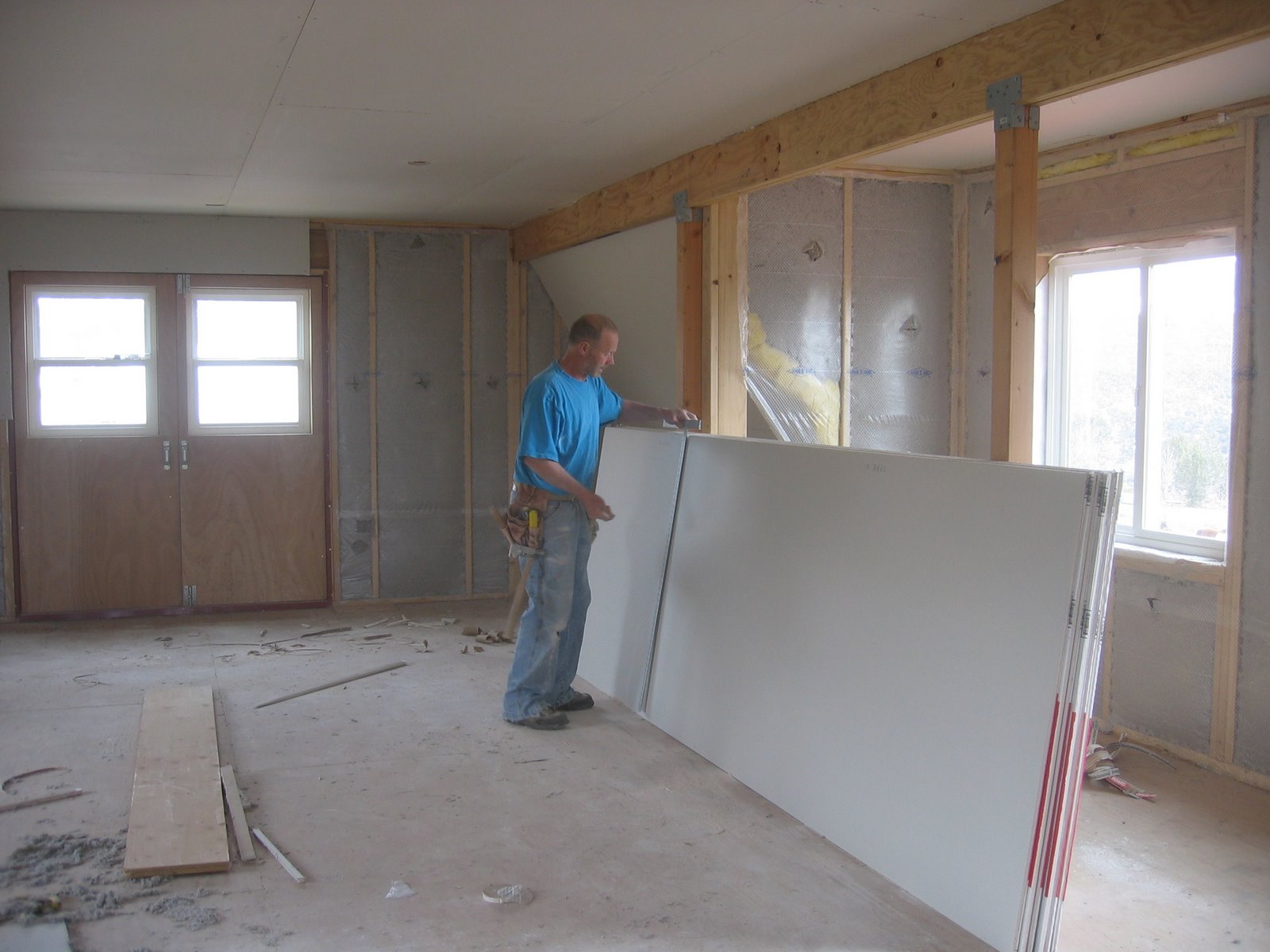 Drywall sheets are being placed in the new shop for construction later. 