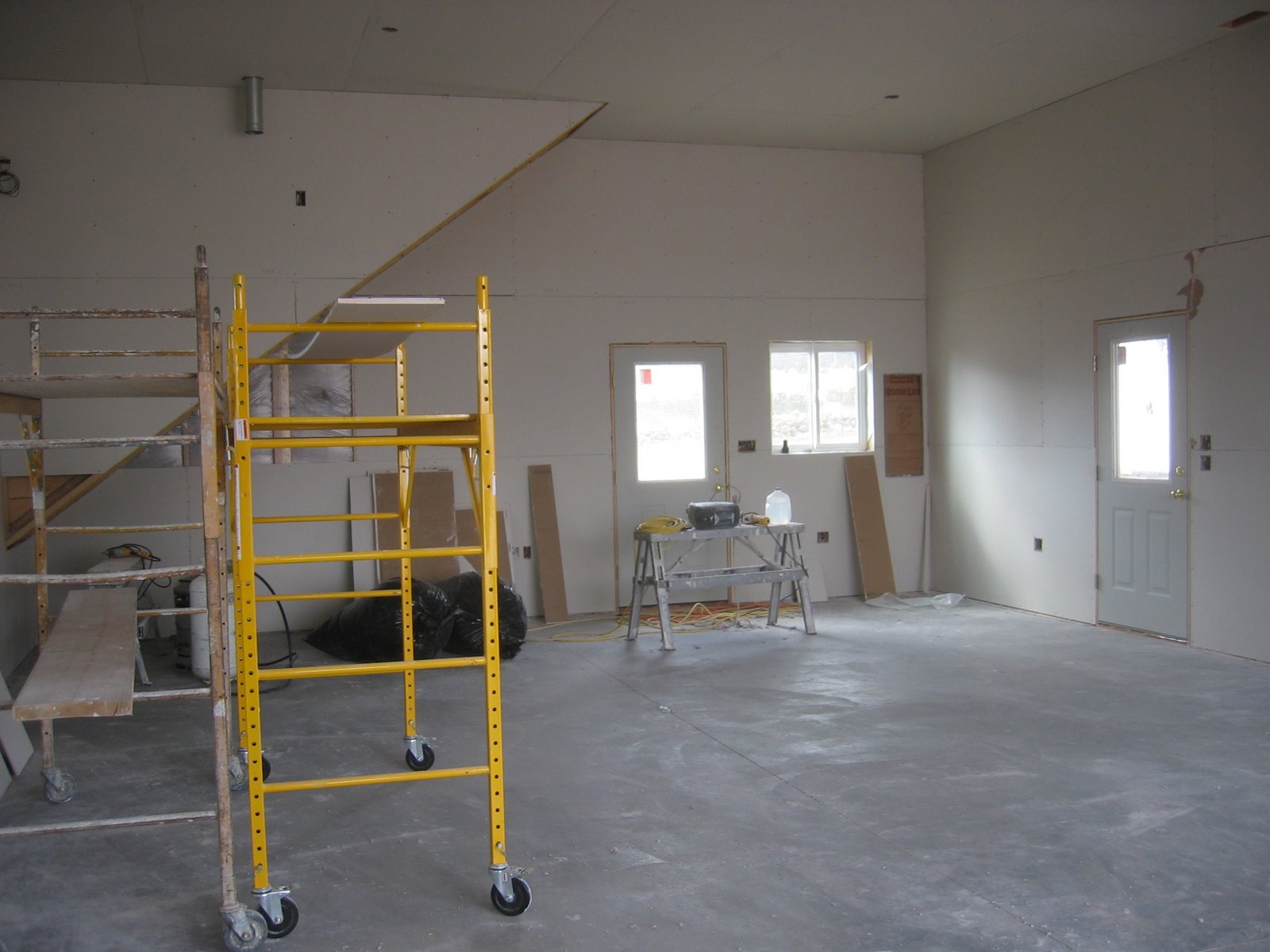 Part of the drywall is up in the new shop. 