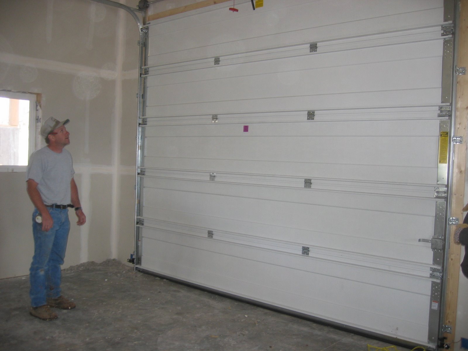 The garage door is finally installed in the shop.
