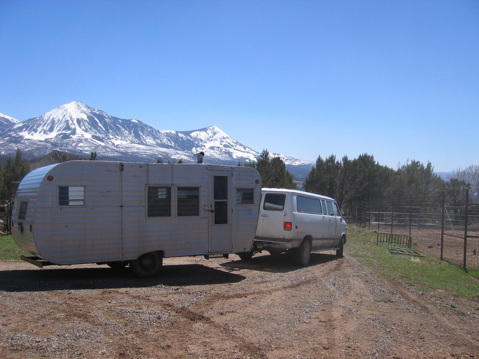 The old trailer is finally being towed away.