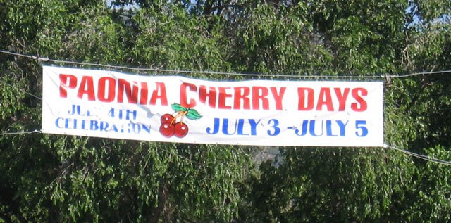 A large banner advertises the Paonia Cherry Days festival.