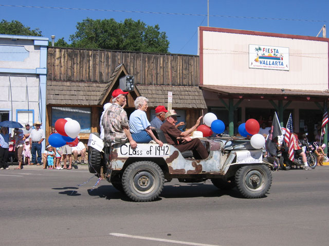 This class is driving through on an old military vehicle.
