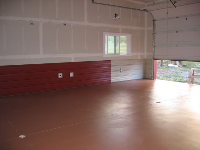This side of the shop uses mostly red metal roofing, with a touch of white.