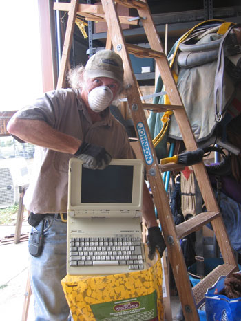 Ken poses with a non-working computer.