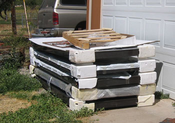 The solar connectors are stacked nicely in piles, with styrofoam spacers to keep them from laying on top of each other.