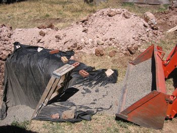Gravel backfilling has begun on the heat sink hole.