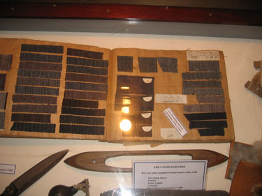 A book full of weaving drafts is shown.