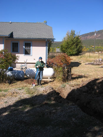 Ken is in the process of digging a trench for the new propane line. 