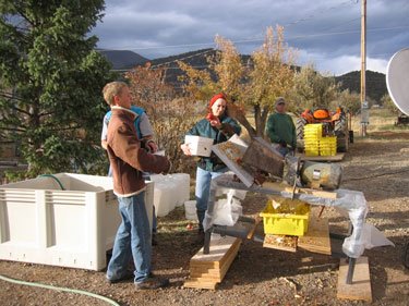 The makeshift apple station is getting apples crushed and ready for pressing.