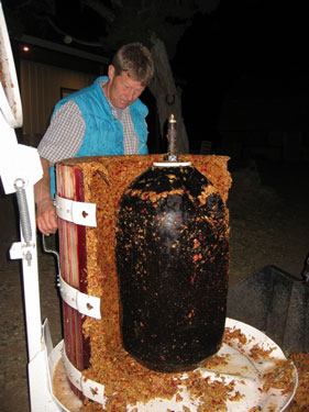 It's time to clean the crushed apple bits out of the wine press.