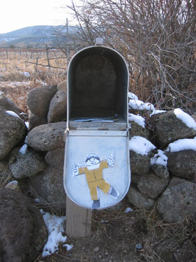 Flat Stanley helps get the mail.