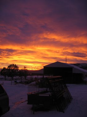 The sunset over the farm is lovely.