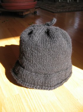 A Monmouth cap, shown with the brim rolled down. 