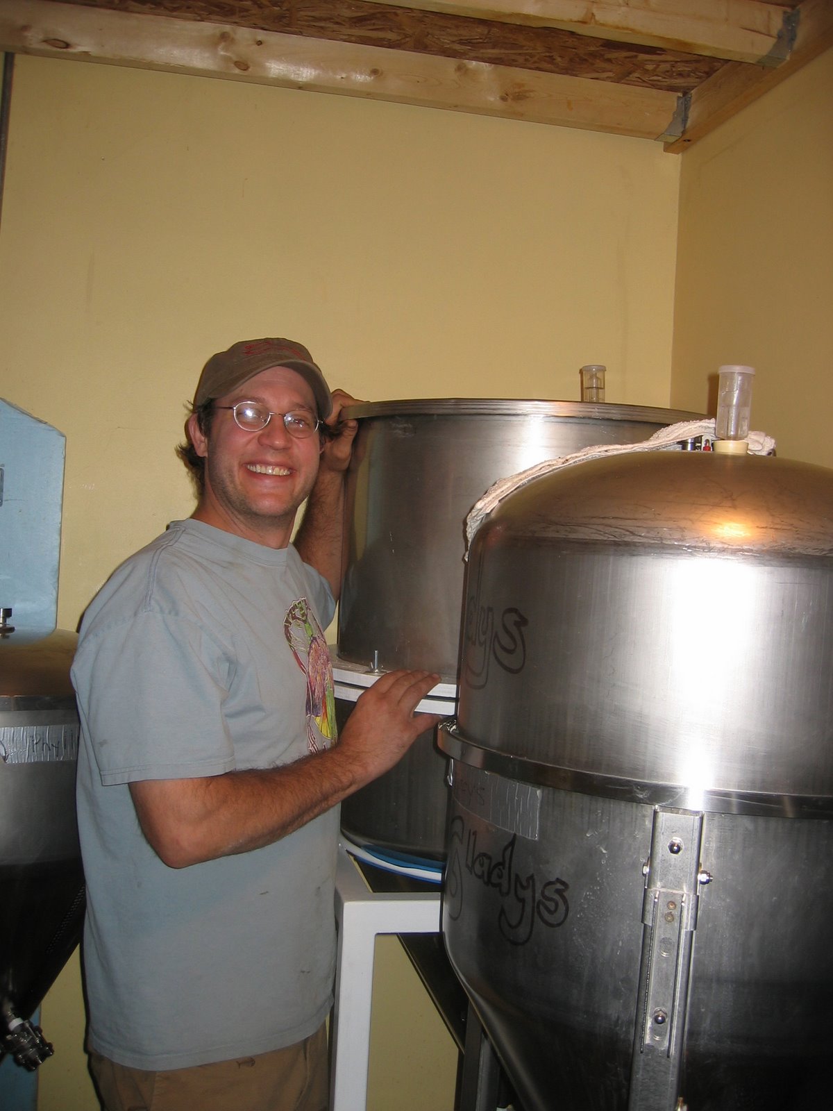 Mike poses next to the new fermenters at Revolution Brewing.