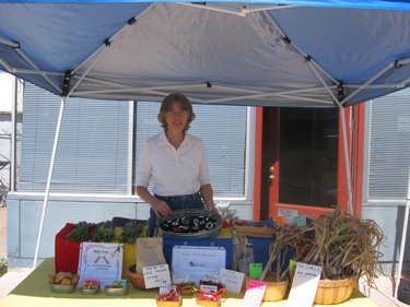 Monica from Small Potatoes Farm is selling her wares.