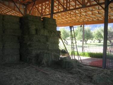 The first few rows of hay bales have fallen over. They'll need to be re-stacked.