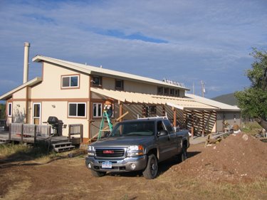 The bracing for the rafters over the new porch is done. 