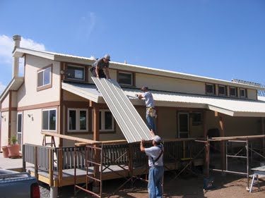 The last of the roof pieces, going up. 