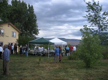 People mill around while the feast is being prepared.