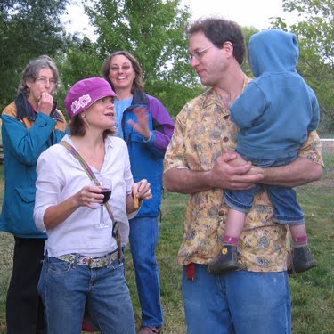 Monica, Sue, Gretchen, Mike, and Riley talk during a candid photo.