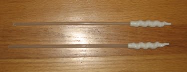 Two modified insemination pipettes.