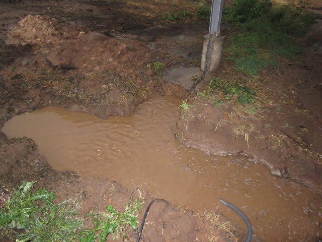 A view of the drainage trench filling with water.
