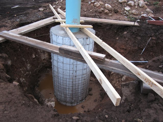 The hole around this concrete pier is collecting water in the bottom.