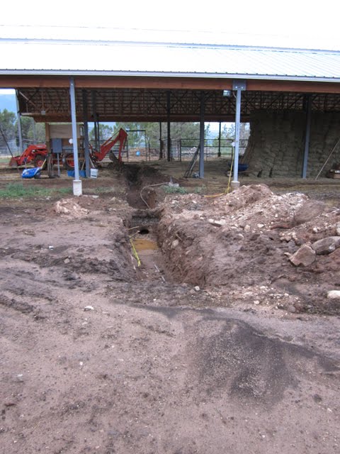 A trench for running wire is also collecting plenty of rainwater.