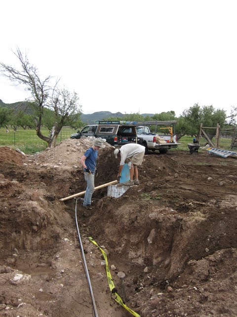 Trenches to run wires and conduit underground can be seen.