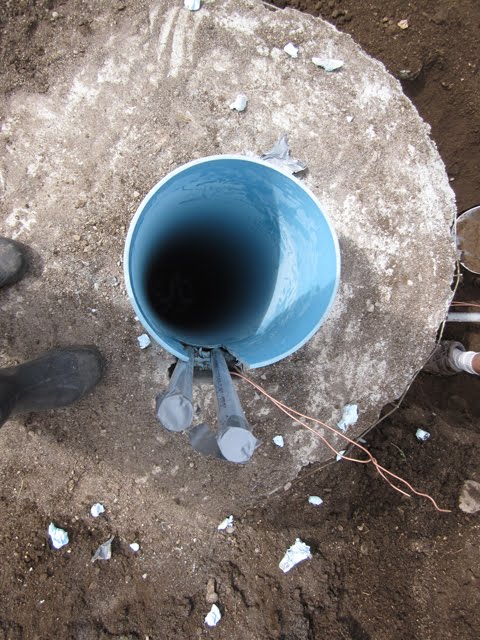 This is a view down inside a plastic pipe sleeve. It will eventually support a tall, metal pole.