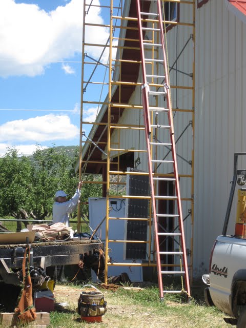 The pulley system in action, plus a view of the scaffolding and a very tall ladder. 