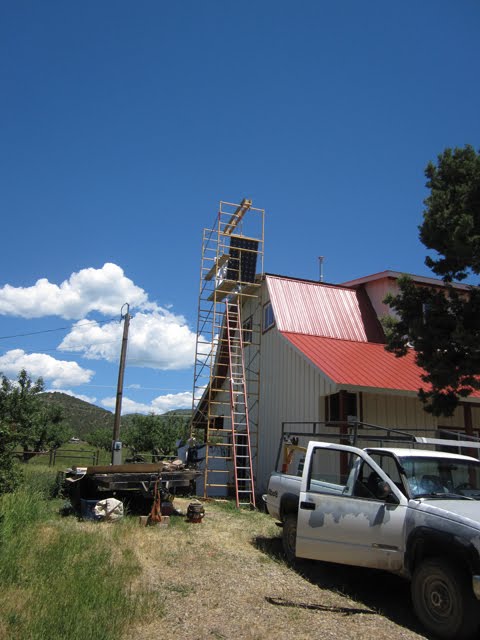 The solar panel made it to the top of the scaffolding. 