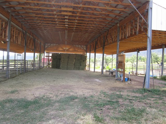 The hay barn is nearly empty, ready to be stocked with new hay.
