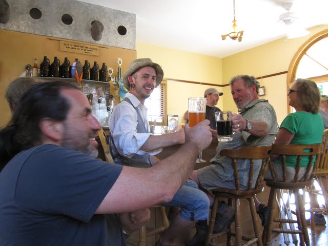 Alan and friends toast together at Revolution Brewing. 