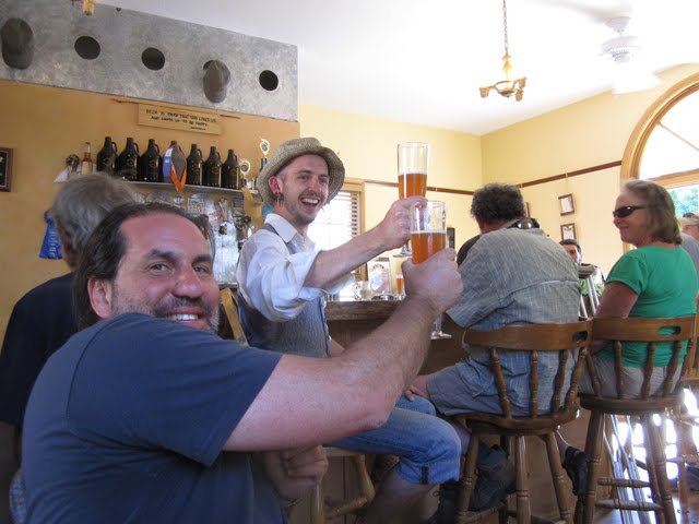 Alan and friends toast together at Revolution Brewing. 