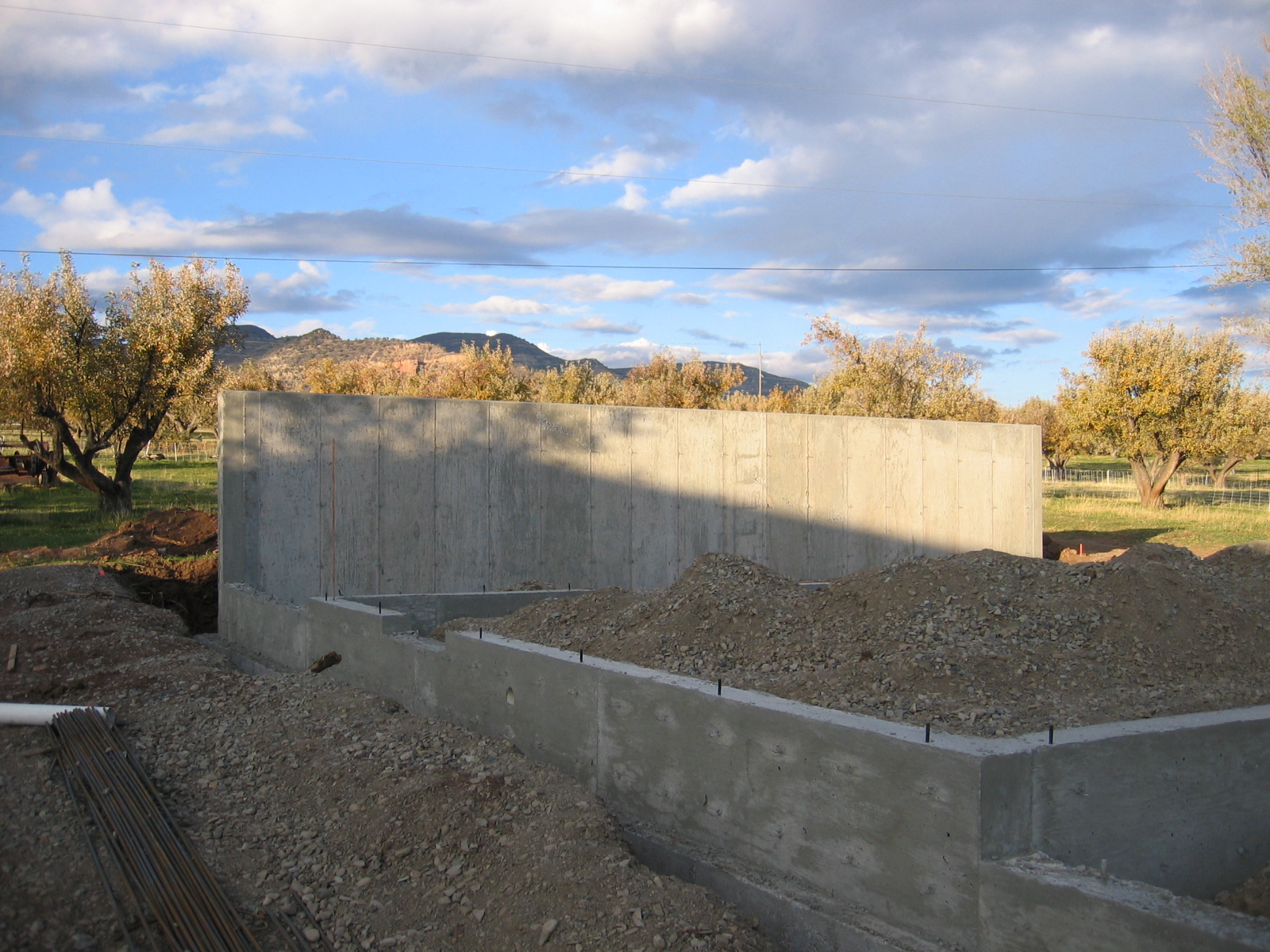 Footings and concrete walls have been poured. 