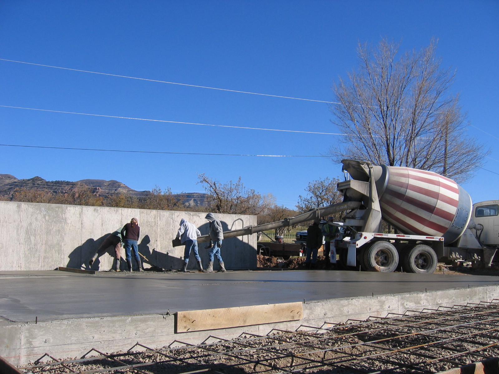 Concrete is being poured for the floors of the new shop. 