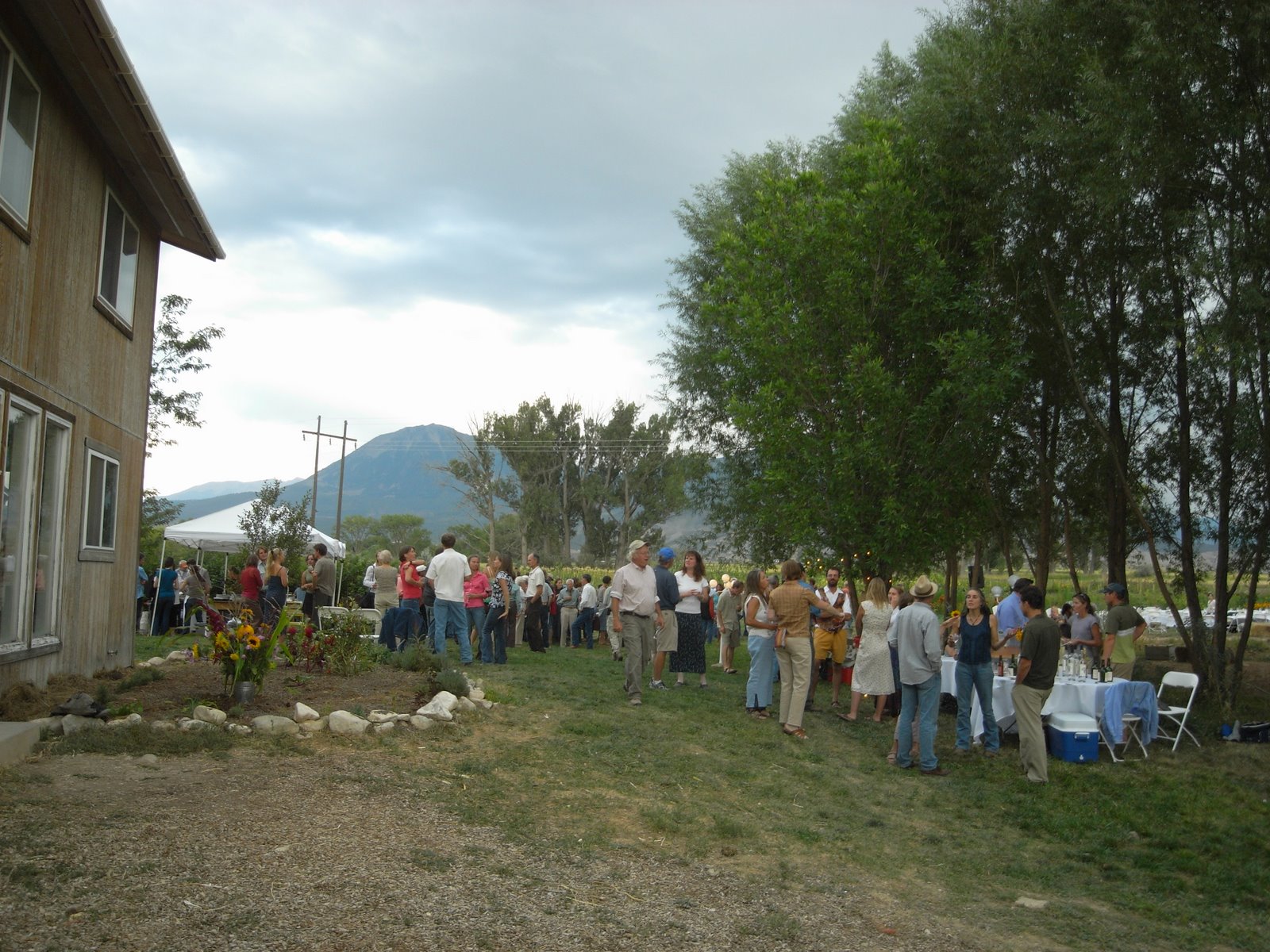 People attend a farm dinner at Zephyros Farm.