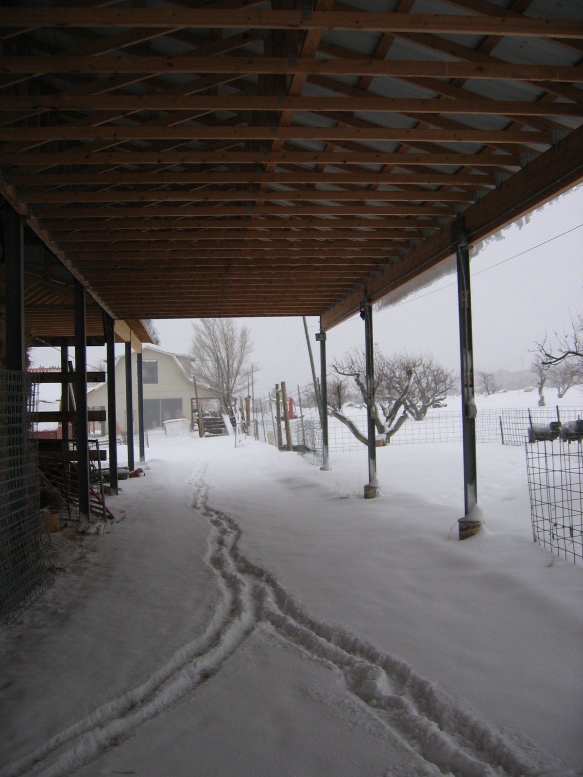 There's even snow under the hay barn.