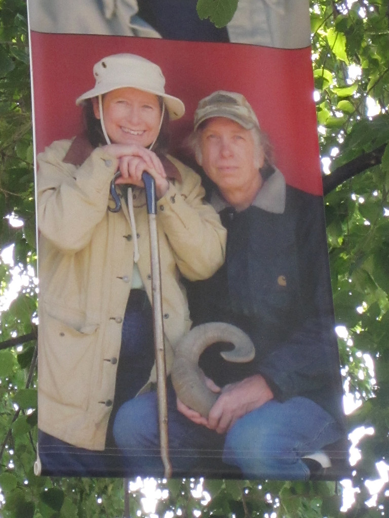 A banner printed with a picture of Ken and Oogie McGuire hangs at the Harvest Festival.