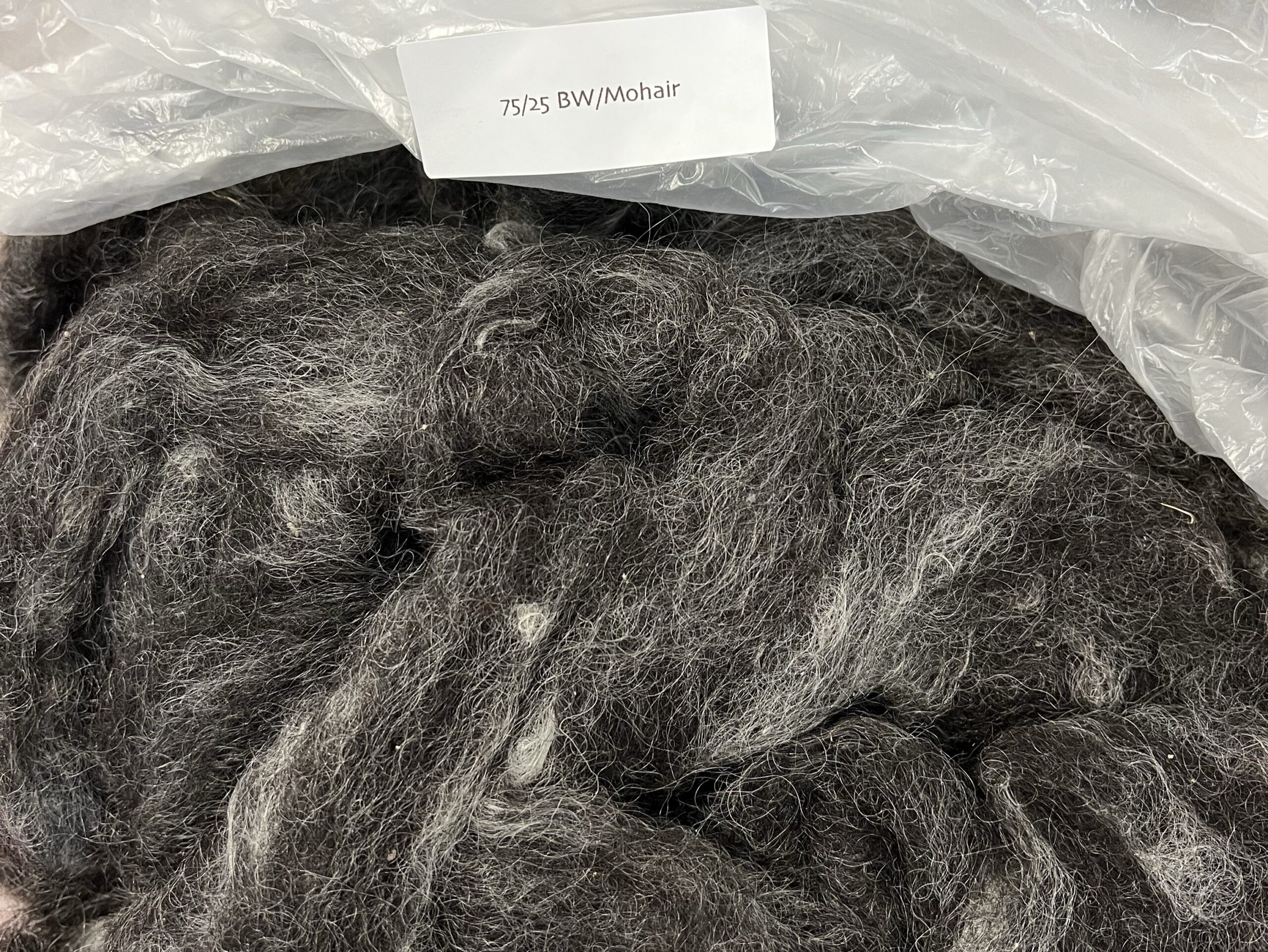 A bag of wool rovings, ready to spin into yarn.